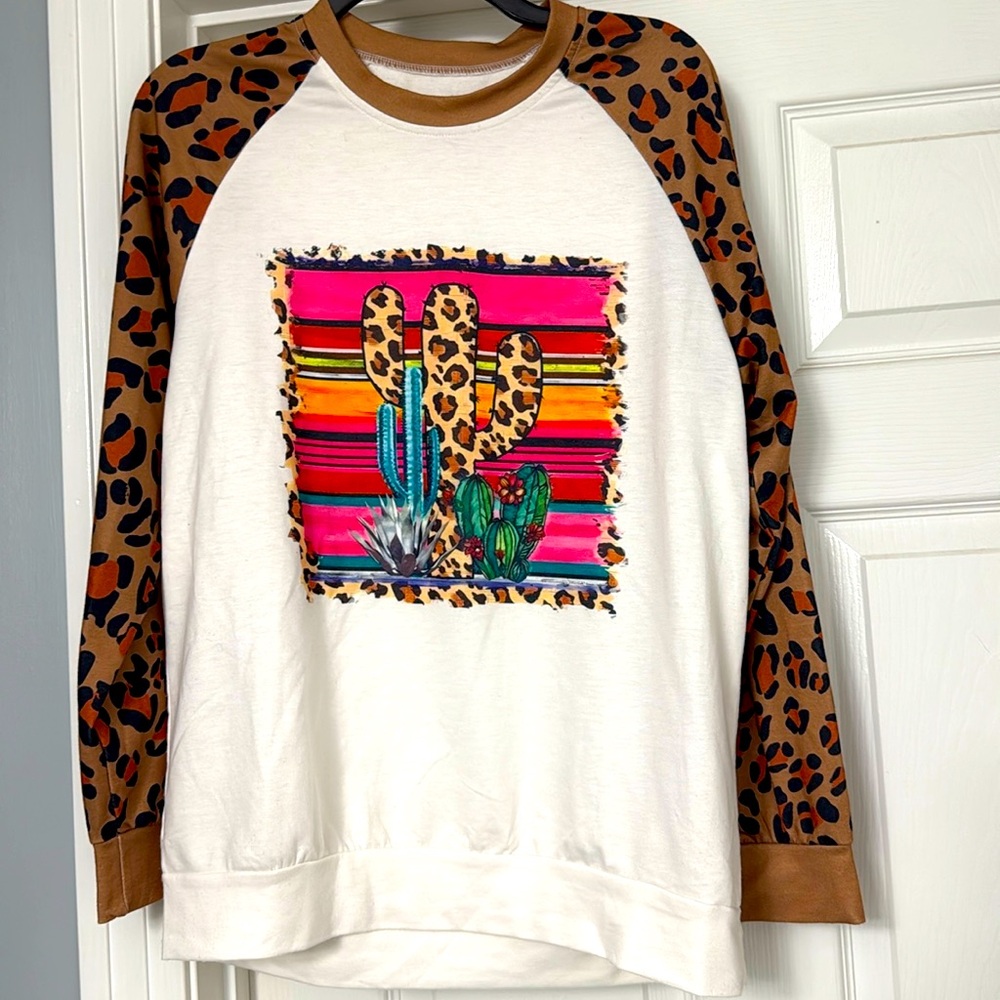 NWOT Southwest cactus tee with animal print sleeves. Sz M
